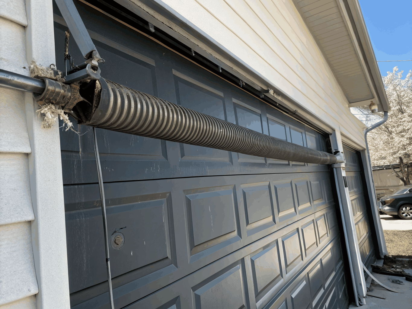 Snapped garage door torsion spring